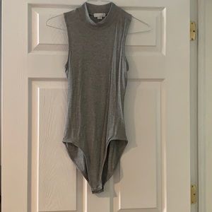 Sleeveless turtleneck bodysuit